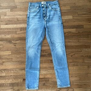 Light wash blue jeans with button fly